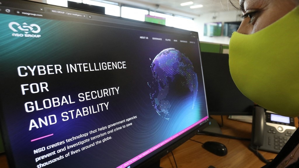 A woman checks the website of Israel-made Pegasus spyware at an office in the Cypriot capital Nicosia on 21 July 2021 (AFP)