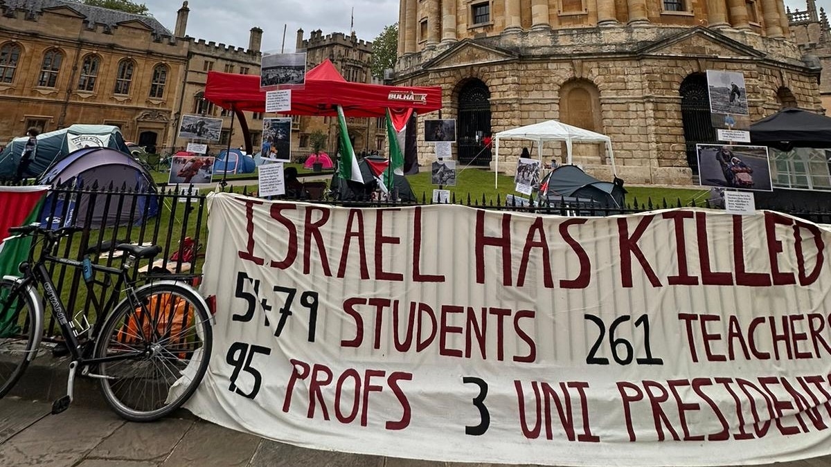 A banner outside the encampment at the Radcliffe Camera, Oxford, 24 May 2024 (MEE/Mohammad Saleh)