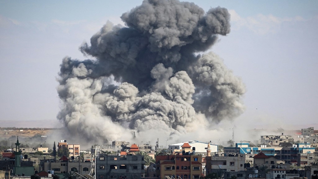 Smoke billows after an Israeli bombardment in Rafah, Gaza, on 6 May 2024 (AFP)
