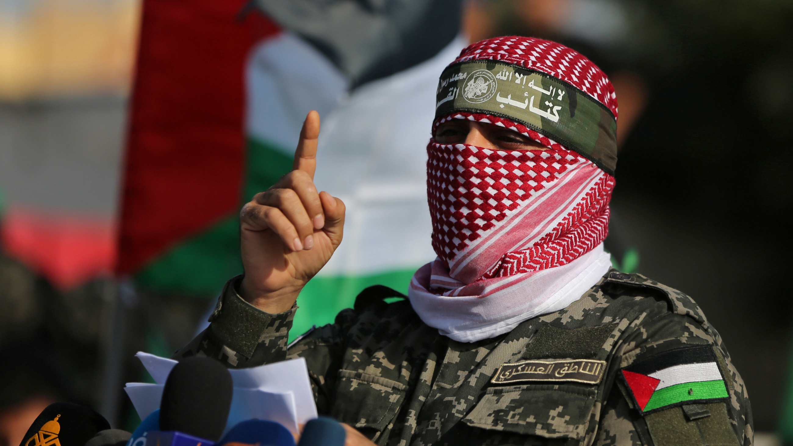 Abu Obeida, spokesman for the Izz al-Din al-Qassam Brigades, the armed wing of Hamas, speaking at a military show in the southern Gaza Strip 11 November 2019 (Reuters/Ibraheem Abu Mustafa)