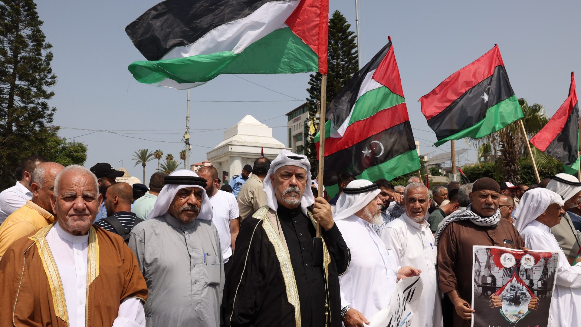 Palestinians participate in a protest supporting the Libyan people for standing against normalisation with Israel, in Gaza City on 31 August 2023 (AFP)