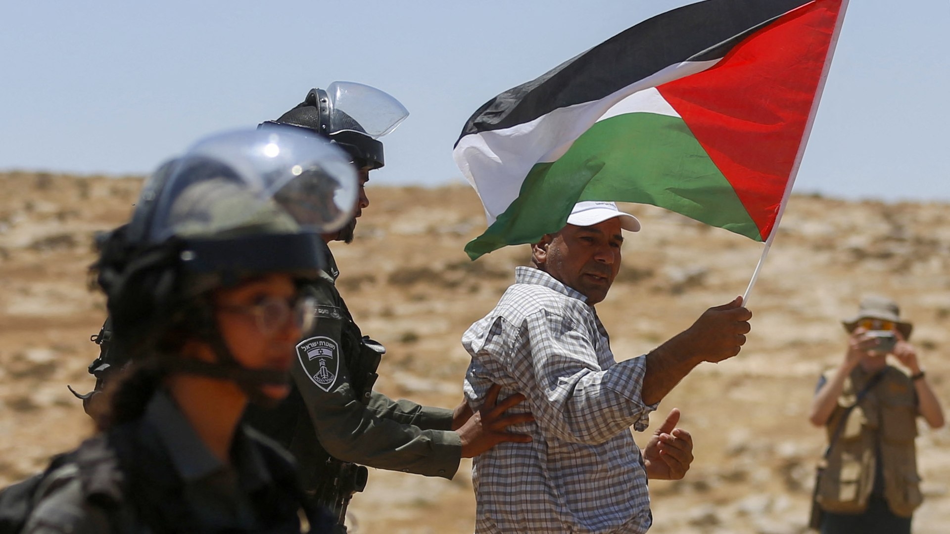Israeli forces remove a demonstrator during a demonstration on 1 July 2022, in Masafer Yatta area in the Israeli-occupied West Bank.