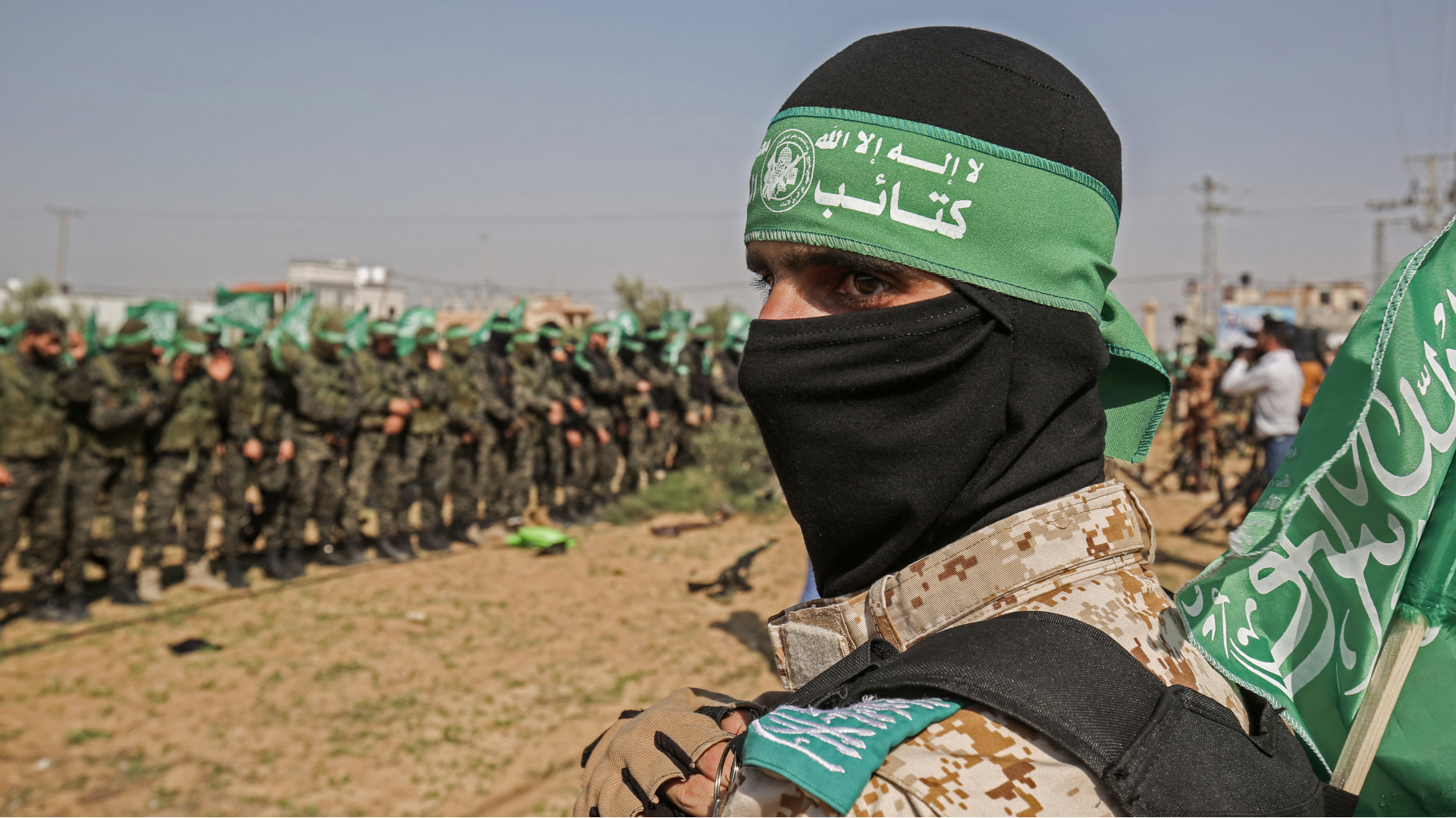 Fighters from the Izzedine al-Qassam Brigades, the armed wing of the Hamas movement, take part in an anti-Israel military show parade in Khan Younis in the southern Gaza Strip 11 November, 2019 (Said Khatib/AFP)