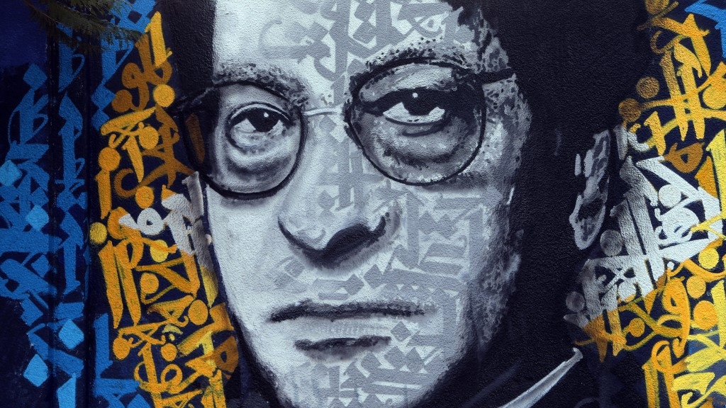 Graffiti in Beirut shows an image of Palestinian poet Mahmoud Darwish in January 2014 (Joseph Eid/AFP)