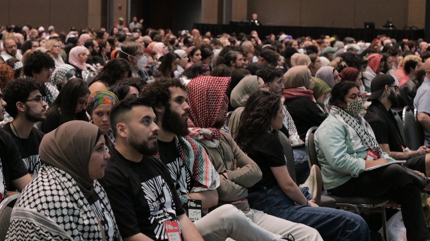 Attendees listen to a plenary session during the People's Conference for Palestine on 25 May 2024.