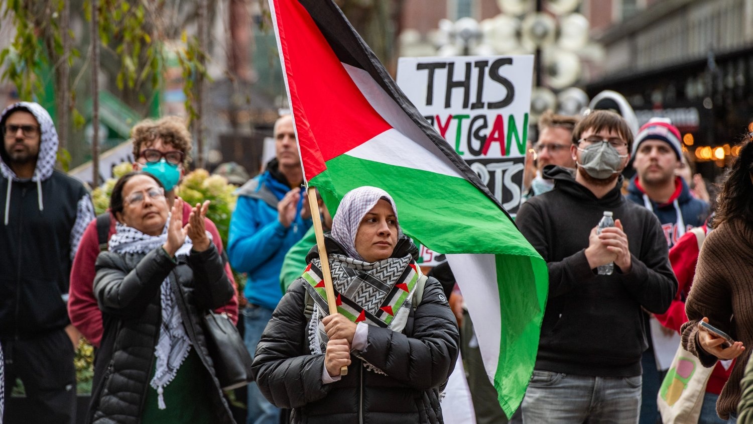 Pro-Palestinian demonstrators gather at Faneuil Hall Marketplace during a "No Votes for Genocide" rally ahead of the US general election in Boston on 2 November 2024.