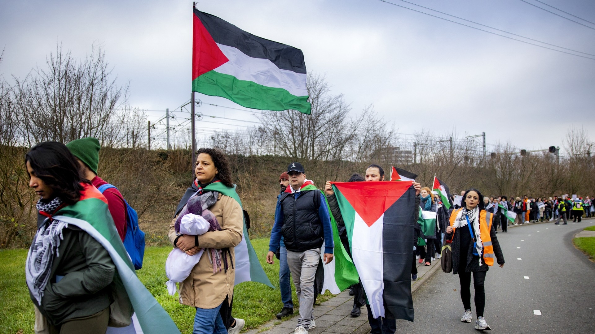 Participants attend a march from Leiden to the International Criminal Court in The Hague, in solidarity with Palestinians of the Gaza Strip, in Leiden, on December 17