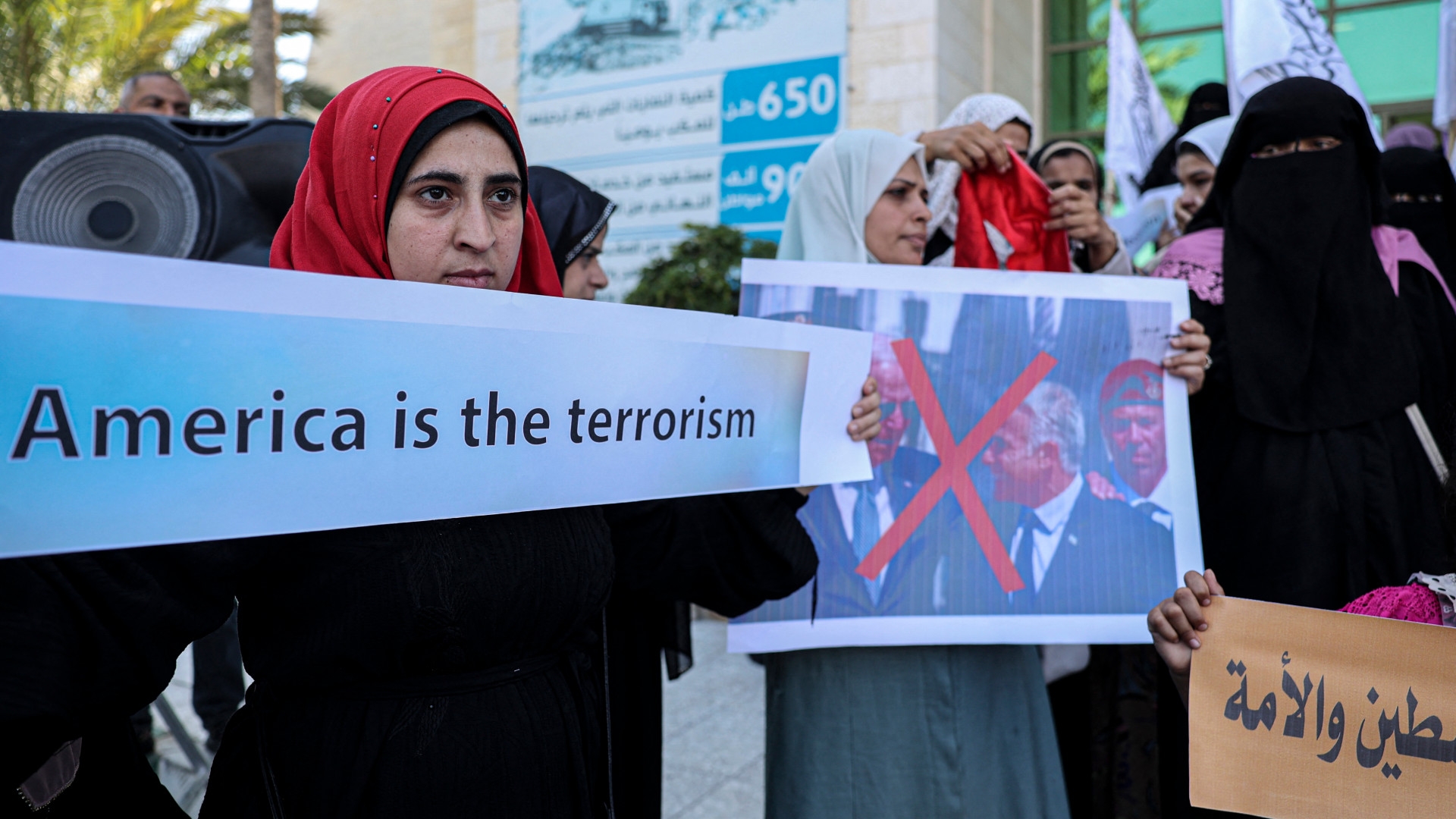 Palestinian women attend a rally against the visit of the US president to Israel, in Khan Yunis in the southern Gaza Strip, on 17 July 2022 (Said Khatib/AFP)