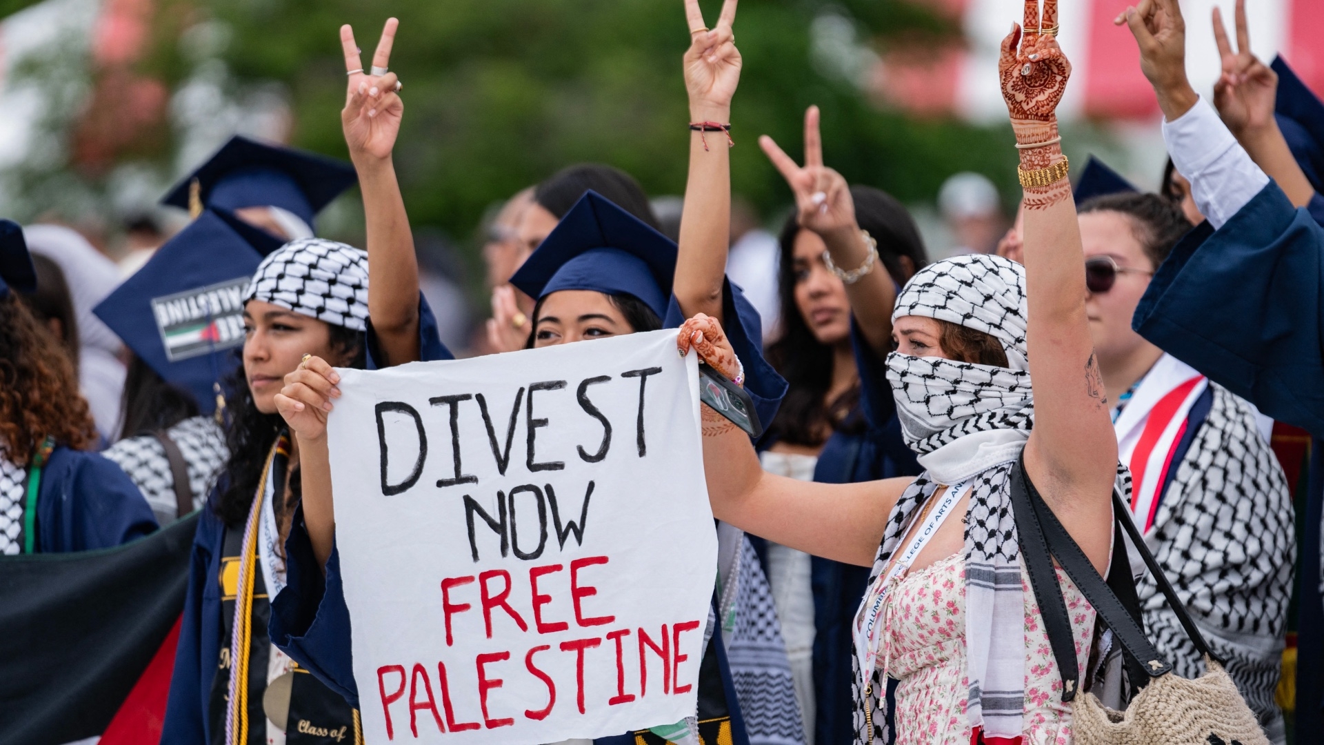 Graduating students protest in support of Palestinians during George Washington University's graduation ceremony on the National Mall on 19 May 2024 in Washington, DC (Andrew Thomas/AFP)