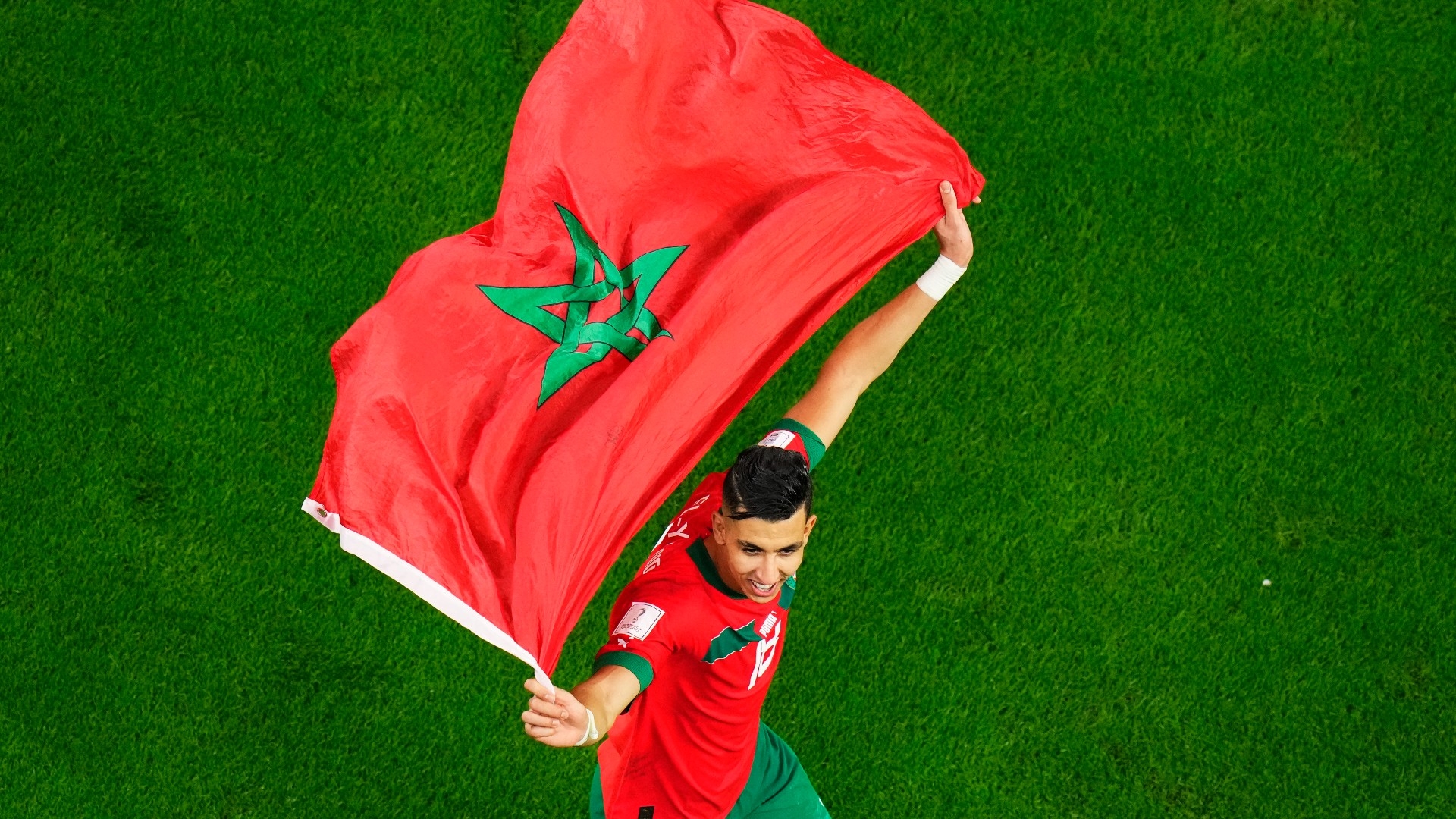 Morocco's Jawad El Yamiq celebrates after the World Cup round of 16 soccer match between Morocco and Spain, at the Education City Stadium in Al Rayyan, Qatar, on 6 December, 2022 (AFP)