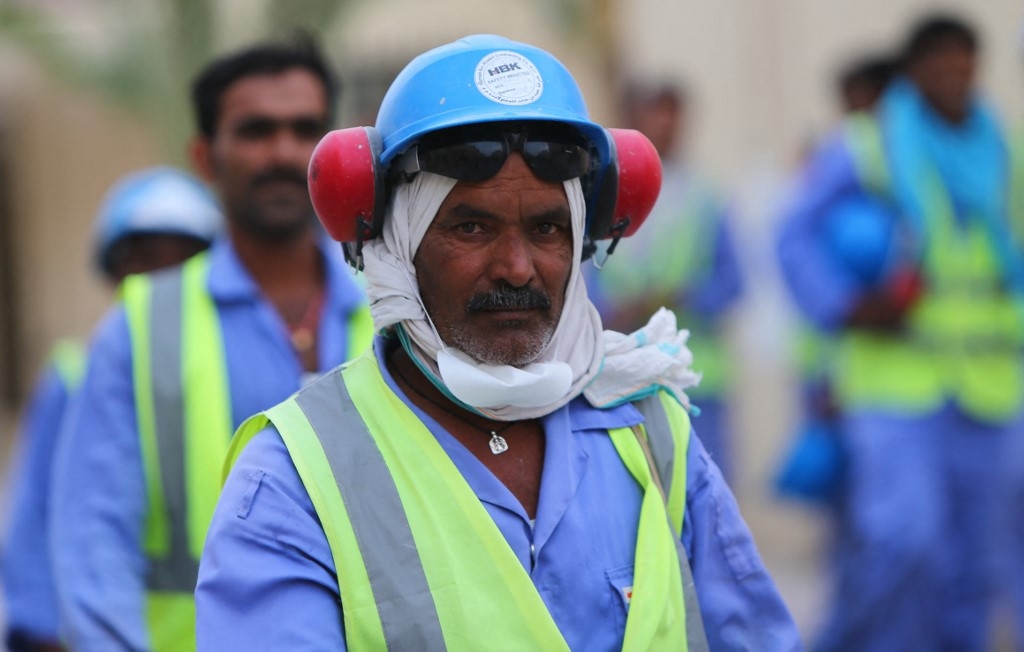 Foreign labourers working on a World Cup football stadium are pictured in Doha in May 2015 (AFP)