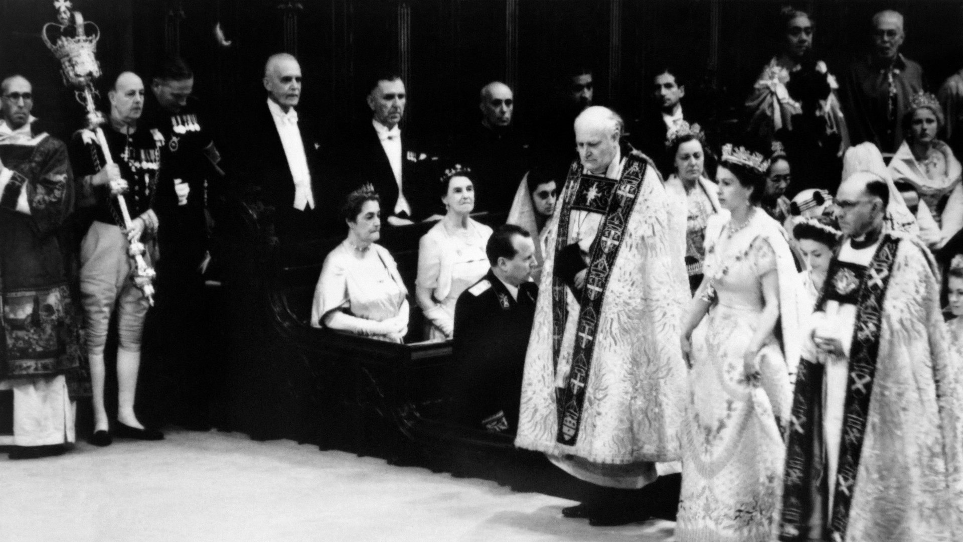 Queen Elizabeth II arrives for her coronation on 2 June 1953 at Westminster Abbey in London (AFP)