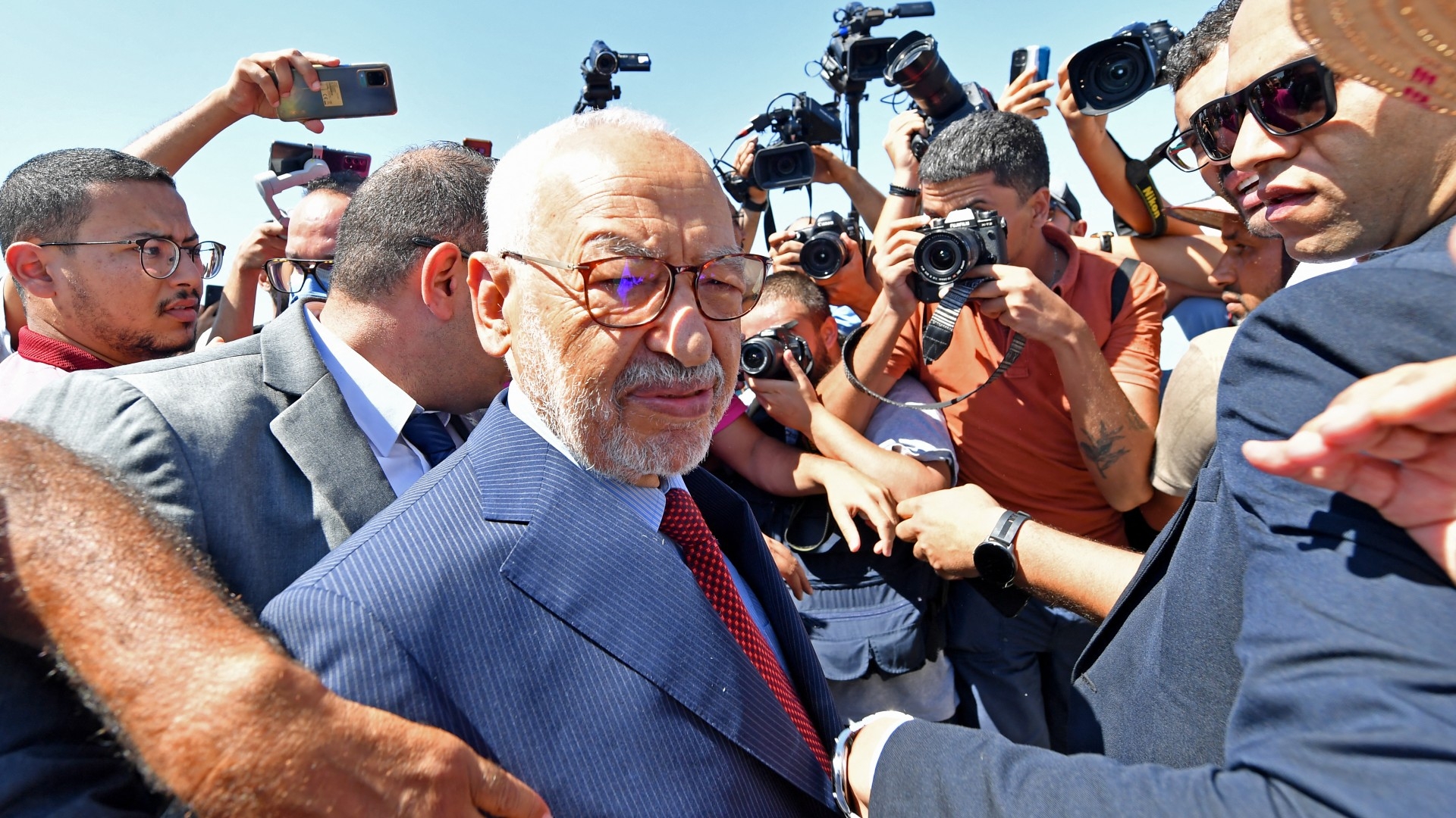 Rached Ghannouchi, head of Tunisia's Islamist Ennahda party, arrives at the office of Tunisia's counter-terrorism prosecutor in Tunis on 19 July 2022 (AFP)