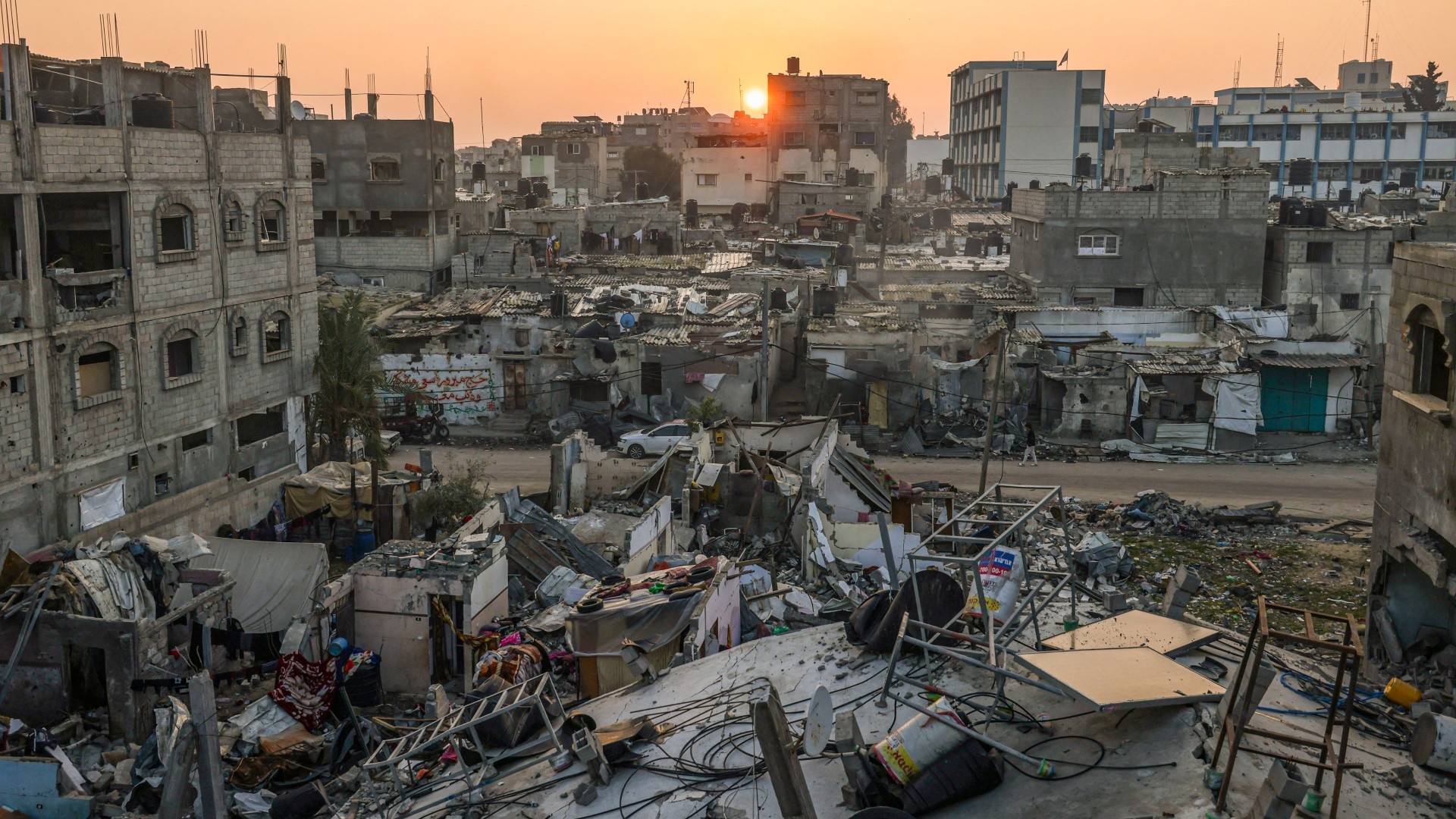 The sun rises above the Rafah refugee camp in the southern Gaza Strip on 1 January 2024 (AFP)