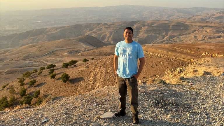 Rajiv Sinha at a viewing point on Mount Hebo in Jordan overlooking the occupied Palestinian territories