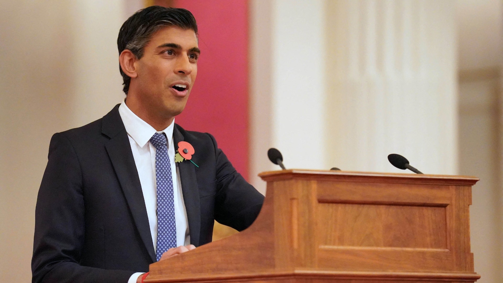 Britain's Prime Minister Rishi Sunak delivers a speech at a reception for world leaders, business figures and environmentalists at Buckingham Palace in London on 4 November 2022 (AFP)