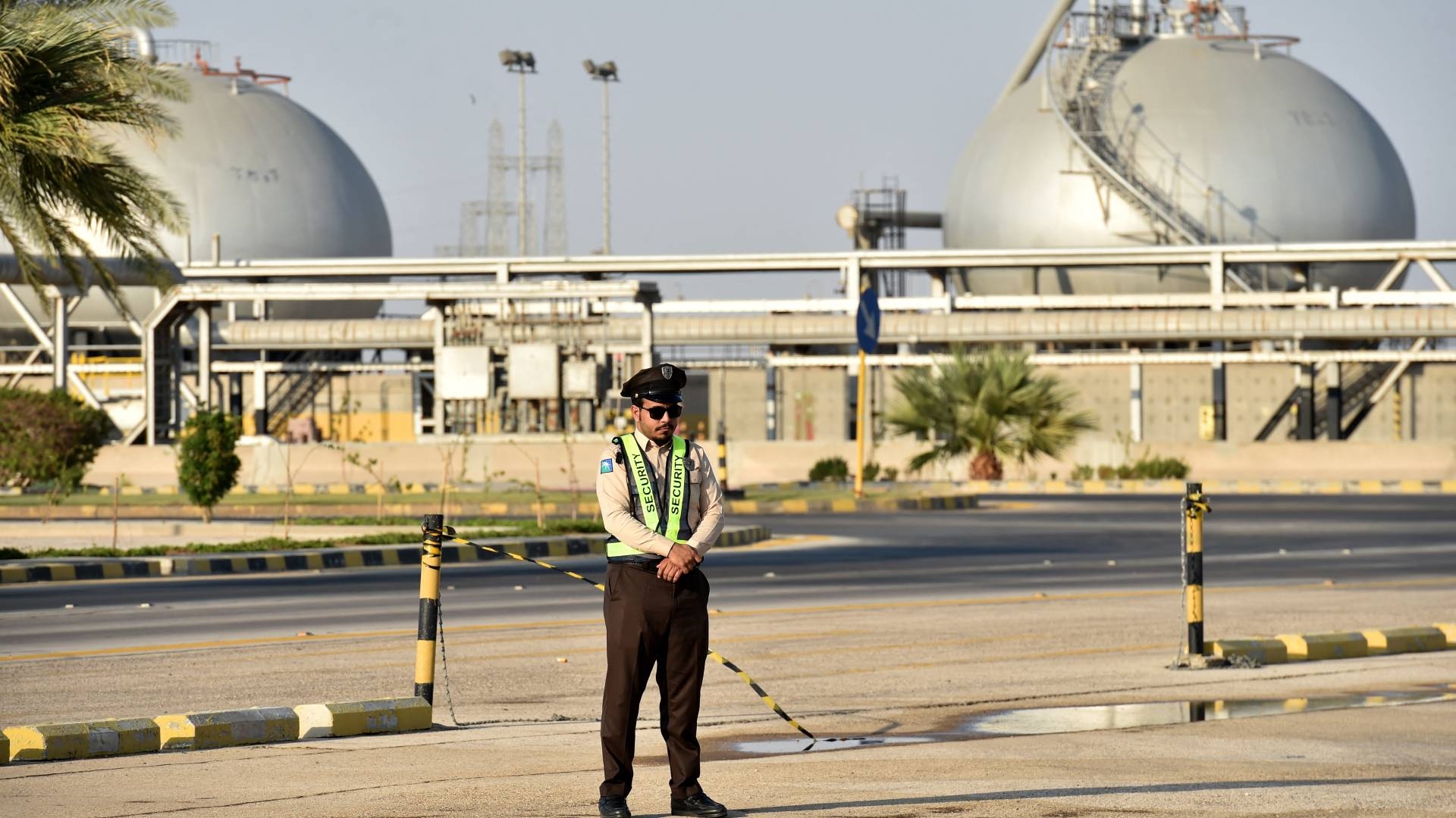 A security officer stands guard at the entrance of Saudi Arabia's Abqaiq oil processing plant on 20 September 2019