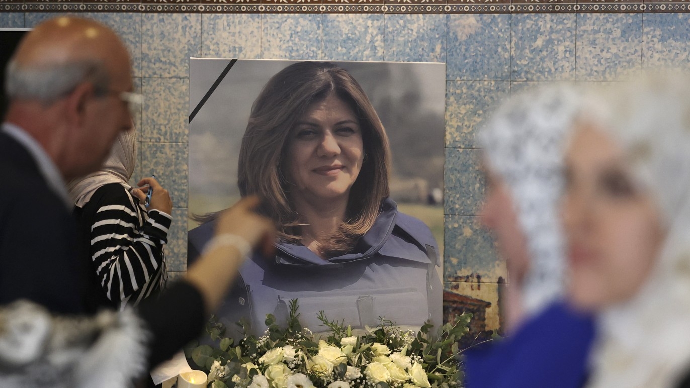 Mourners attend a memorial ceremony for Shireen Abu Aqleh, to mark the 40th day of the killing of the Al Jazeera journalist, in the West Bank city of Ramallah on 19 June 2022.