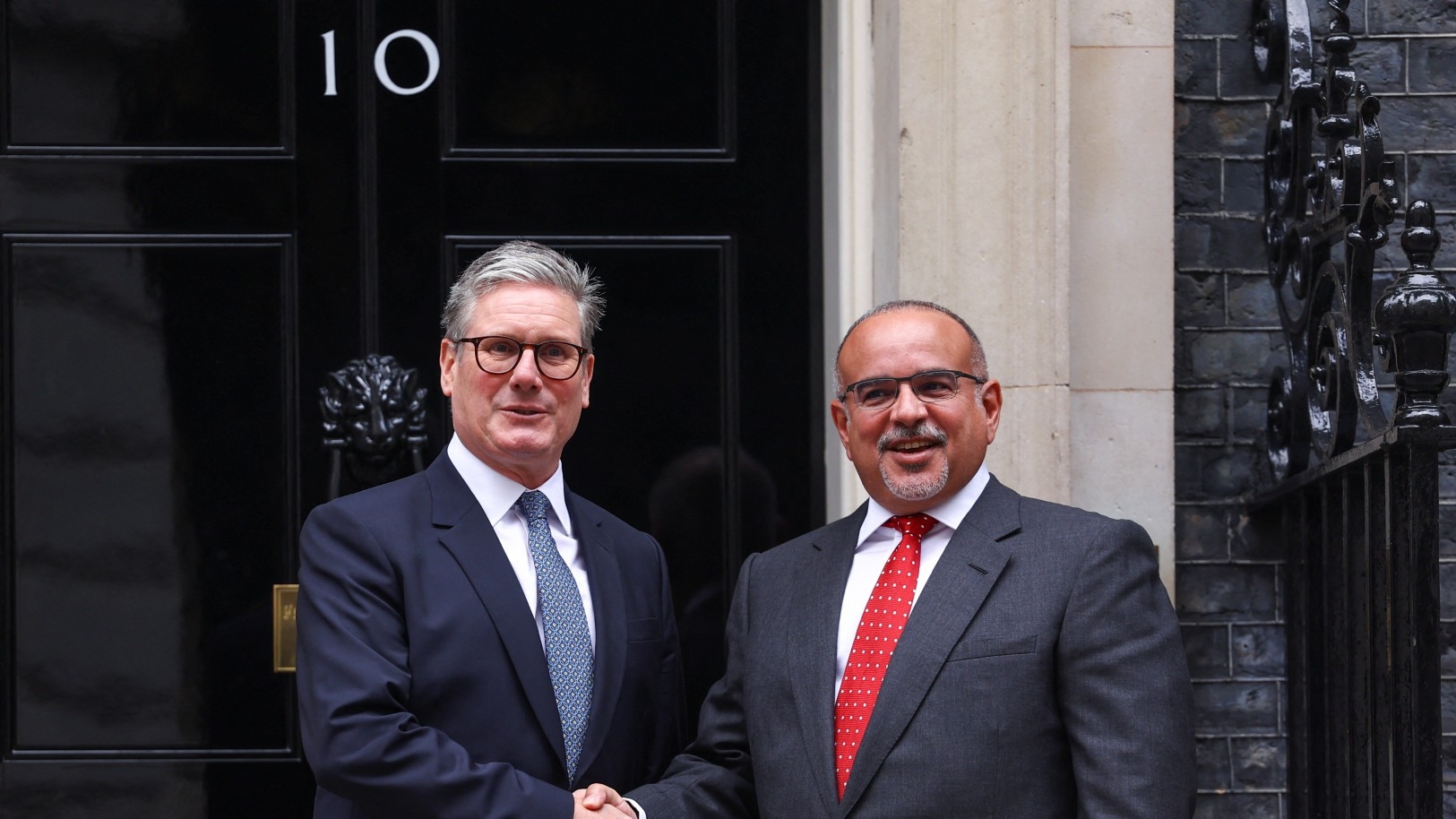 British Prime Minister Keir Starmer shakes hands with Bahrain's Prime Minister and Crown Prince Sheikh Salman bin Hamad al-Khalifa at Downing Street, in London, Britain August 27, 2024. REUTERS/Hannah McKay