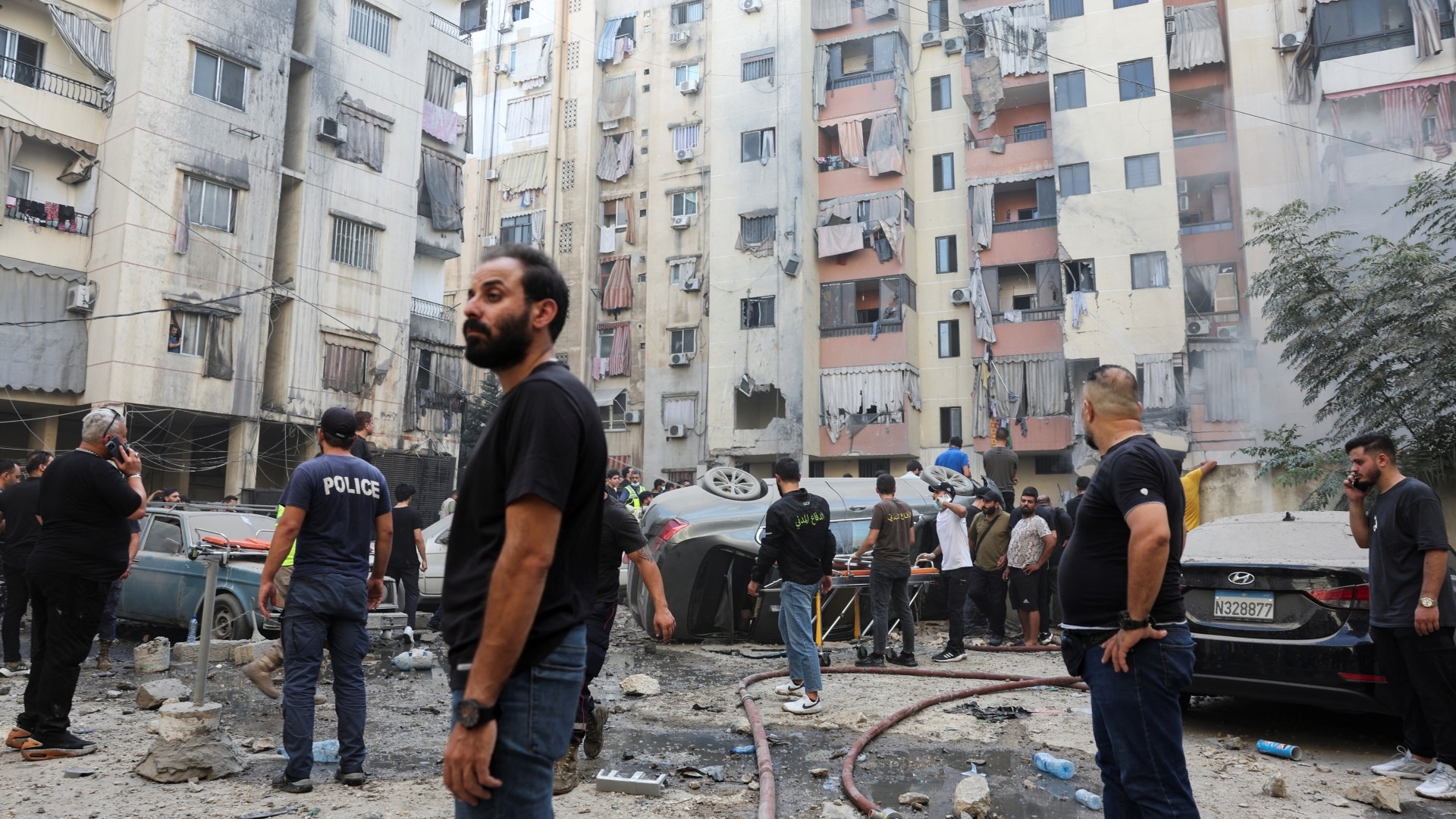 People inspect the site of an Israeli strike in a southern suburb of Beirut, Lebanon, on 20 September 2024 (Reuters/Mohamed Azakir)