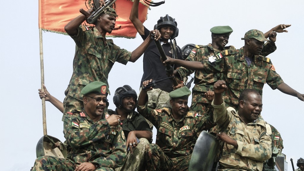 Members of Sudan's armed forces take part in a military parade held on Army Day in Gadaref state on 14 August 2024 (AFP)