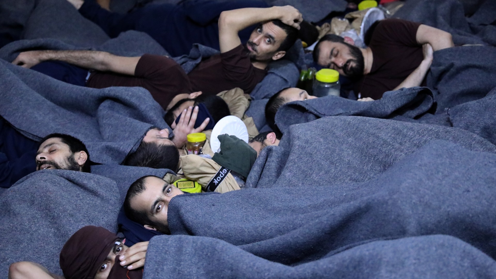 Prisoners suspected of being part of the Islamic State lie inside a prison cell in Hasakah, Syria, 7 January, 2020 (Reuters/Goran Tomasevic)