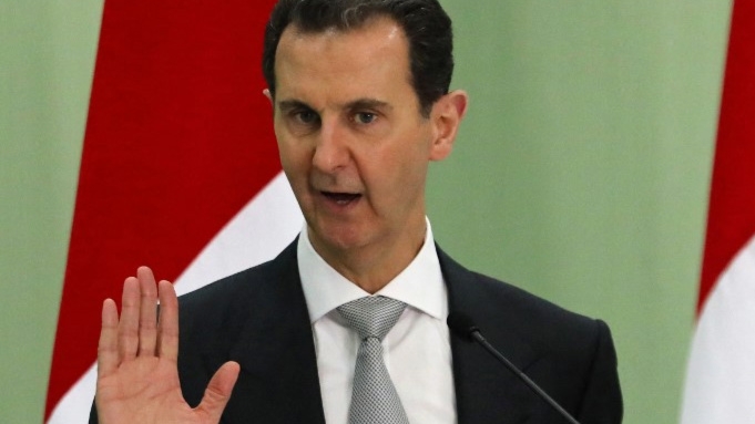 Syrian President Bashar al-Assad speaks in Damascus on 16 July 2023 (Louai Beshara/AFP)