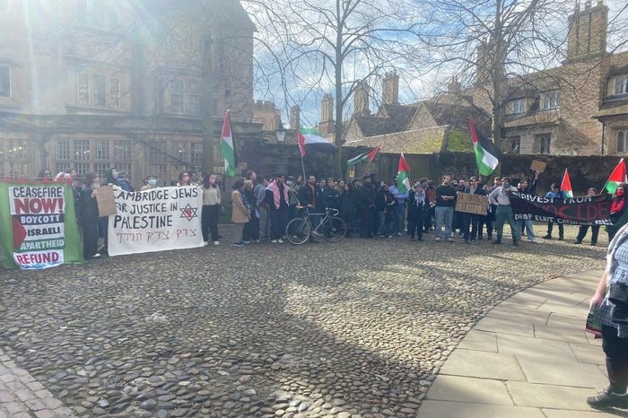 Protestors outside Trinity College in Cambridge, UK. (Varsity)