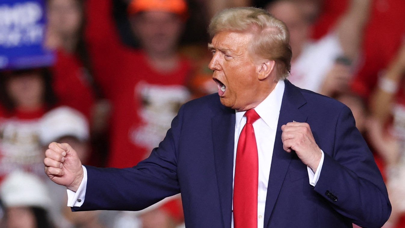 US President-elect Donald Trump dances on stage after speaking at a campaign rally at PPG Paints Arena in Pittsburgh, Pennsylvania on 4 November 2024.