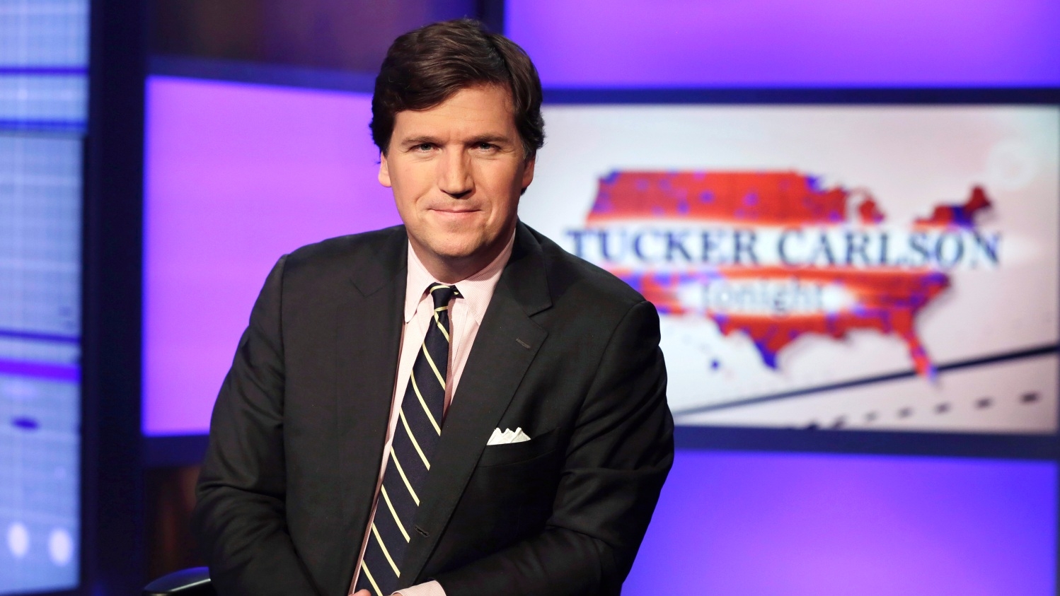 Tucker Carlson, former host of Fox's "Tucker Carlson Tonight," poses for photos in a Fox News Channel studio on 2 March 2017.