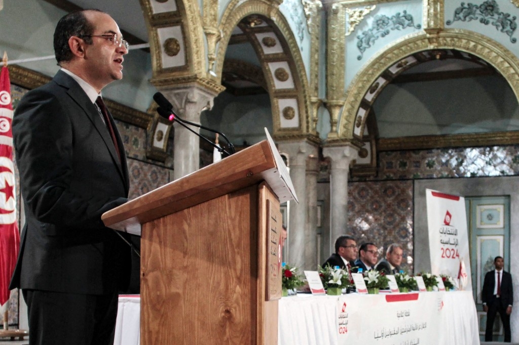 Isie's head Farouk Bouasker announces that three candidates have been cleared to run in the October election, in Tunis on 10 August (HASNA/AFP) 