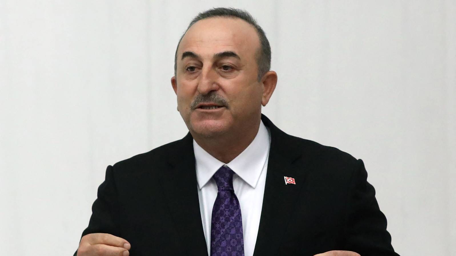 Turkish Foreign Minister Mevlut Cavusoglu speaks ar the Turkish Grand National Assembly in Ankara on 13 December 2021.