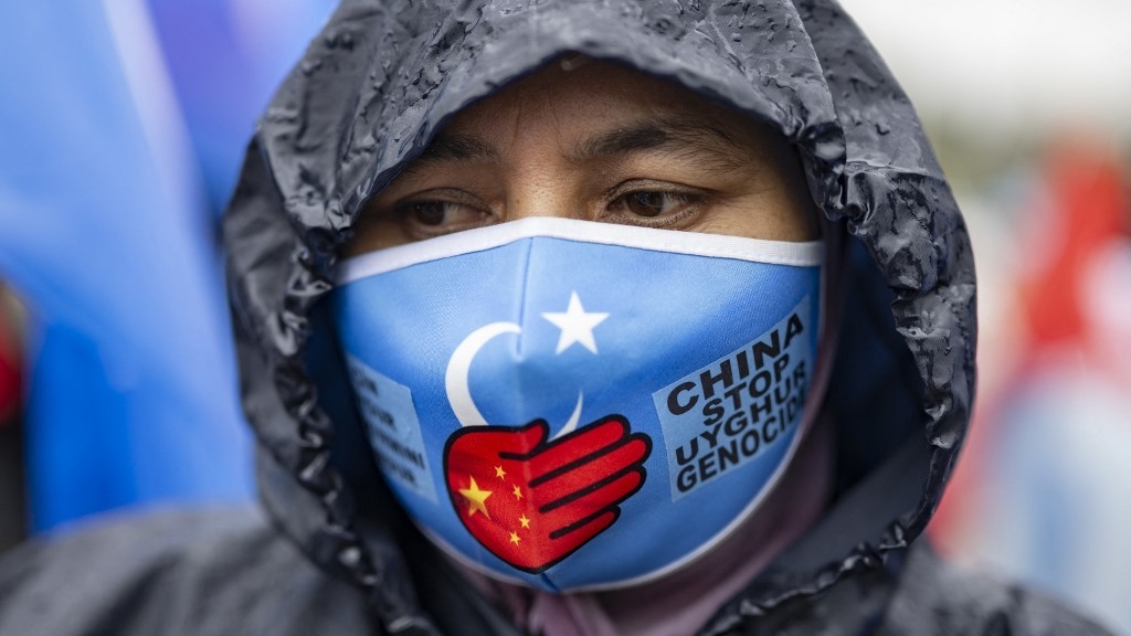 An Uyghur demonstrator takes part in a protest against China near its consulate in Istanbul on 1 October 2023, China's National Day (AFP/file photo)