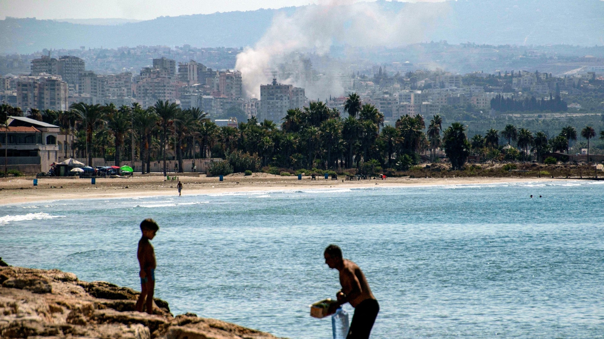 A cloud of smoke erupts during Israeli air strikes on a village south of Tyre in southern Lebanon on 25 September 2024 (AFP/Hasan Fneich)