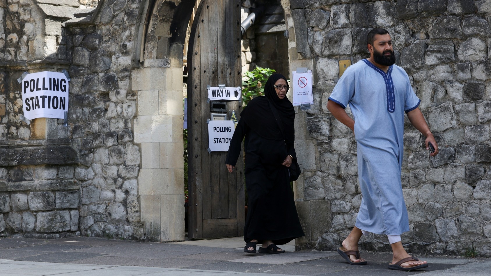 People leave a polling station at Church of St Barnabas in Pimlico during the general election in London on 4 July, 2024 (Hollie Adams/Reuters)