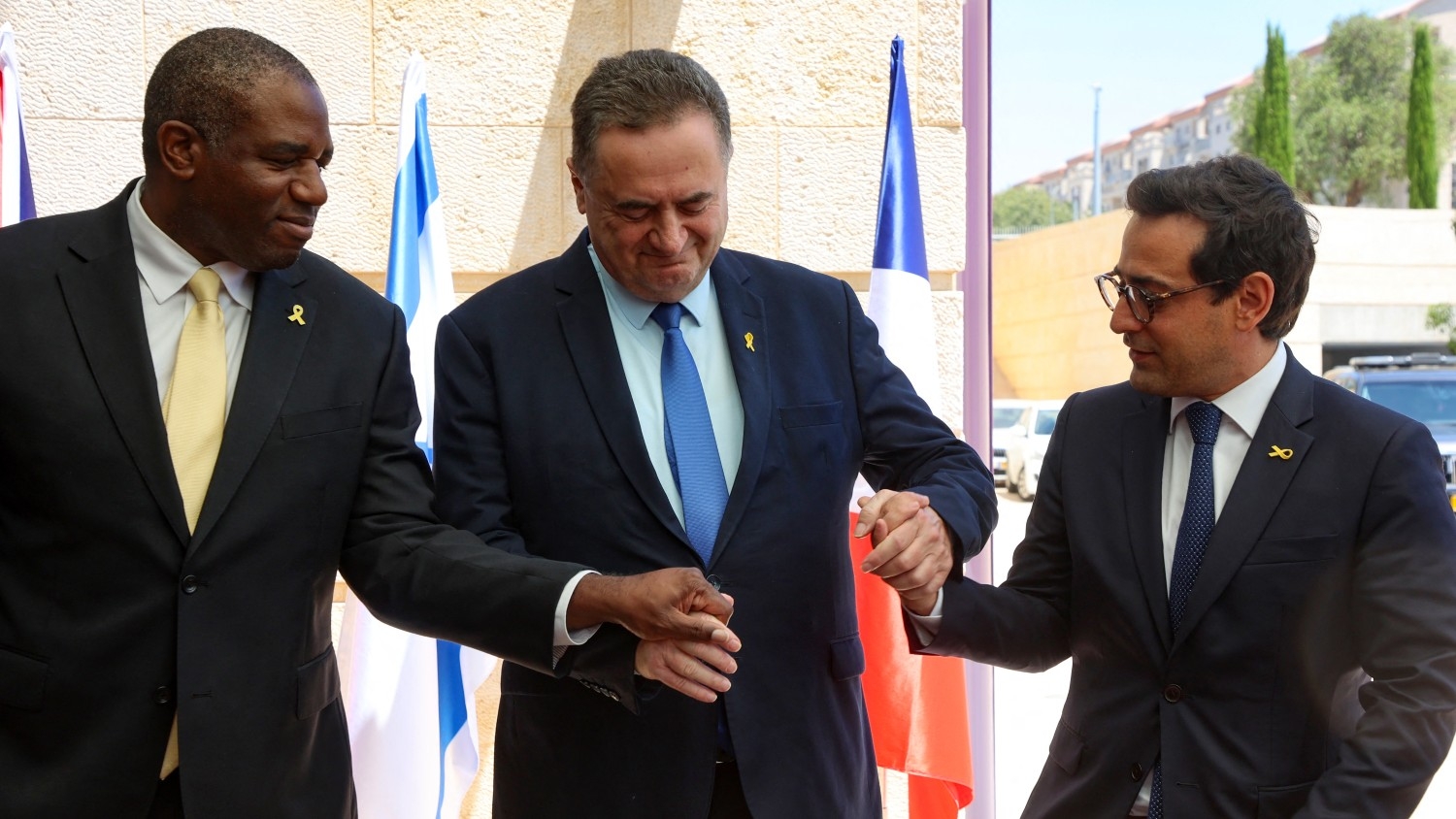 Israel's Foreign Minister Israel Katz (C) prepares to pose for a picture with his French and British counterparts, Stephane Sejourne (R) and David Lammy, ahead of their meeting at the Ministry of Foreign Affairs in Jerusalem on 16 August 2024 (Gil Cohen-Magen/AFP)