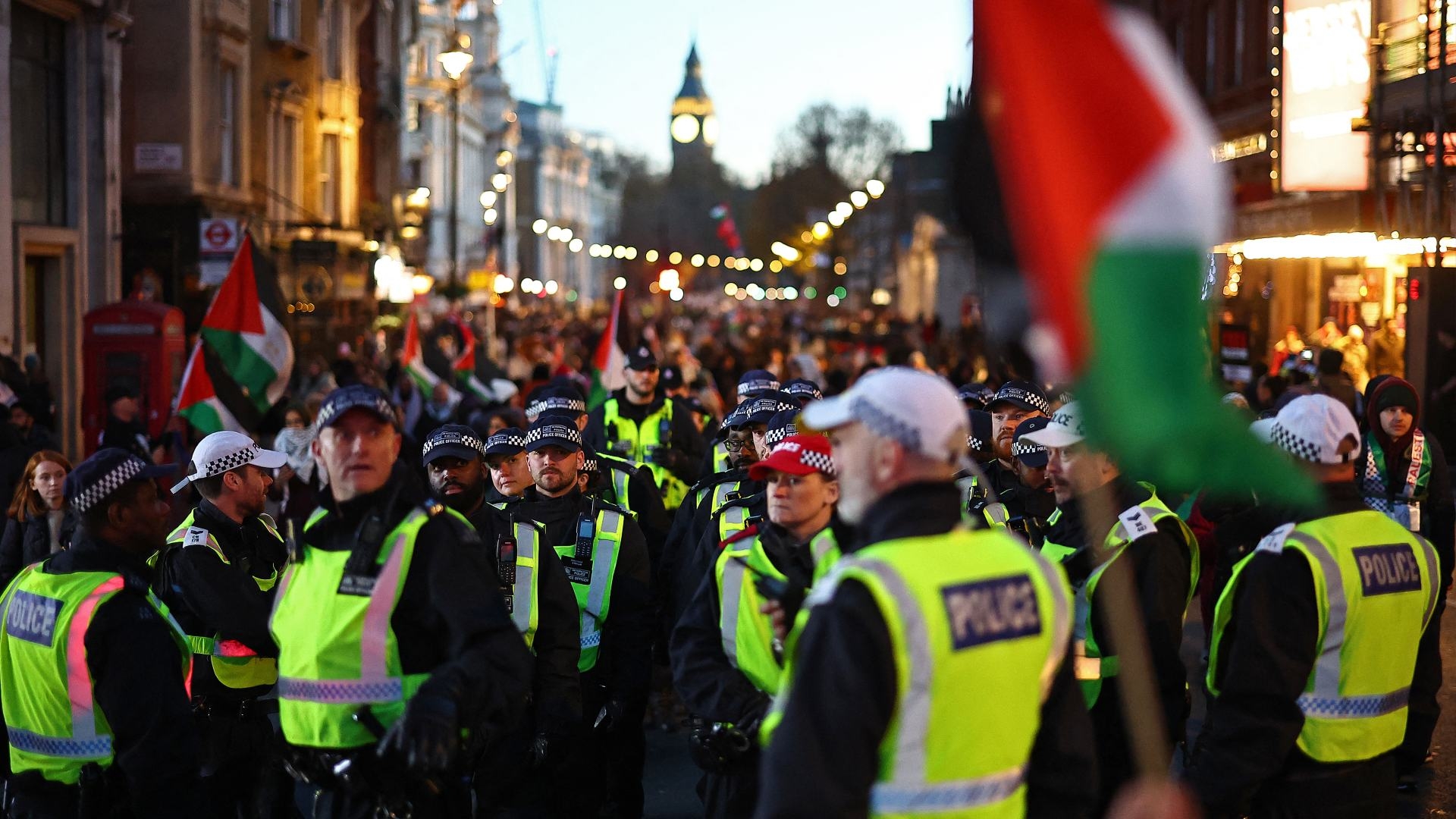 Officers on duty at a pro-Palestine march in London in November 2023. Police chiefs say Prevent referrals have jumped since the start of the war in Gaza (Henry Nicholls/AFP)