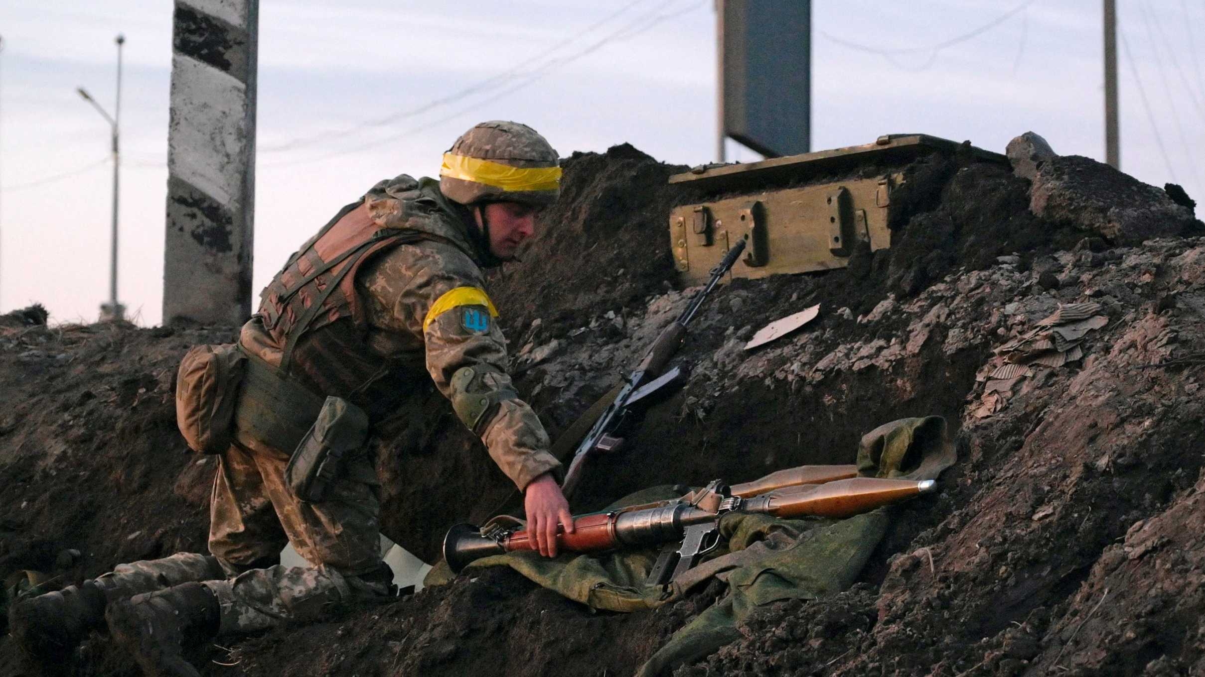 A Ukrainian serviceman holds a rocket-propelled grenade launcher at fighting positions outside the city of Kharkiv, Ukraine on 24 February 2022.