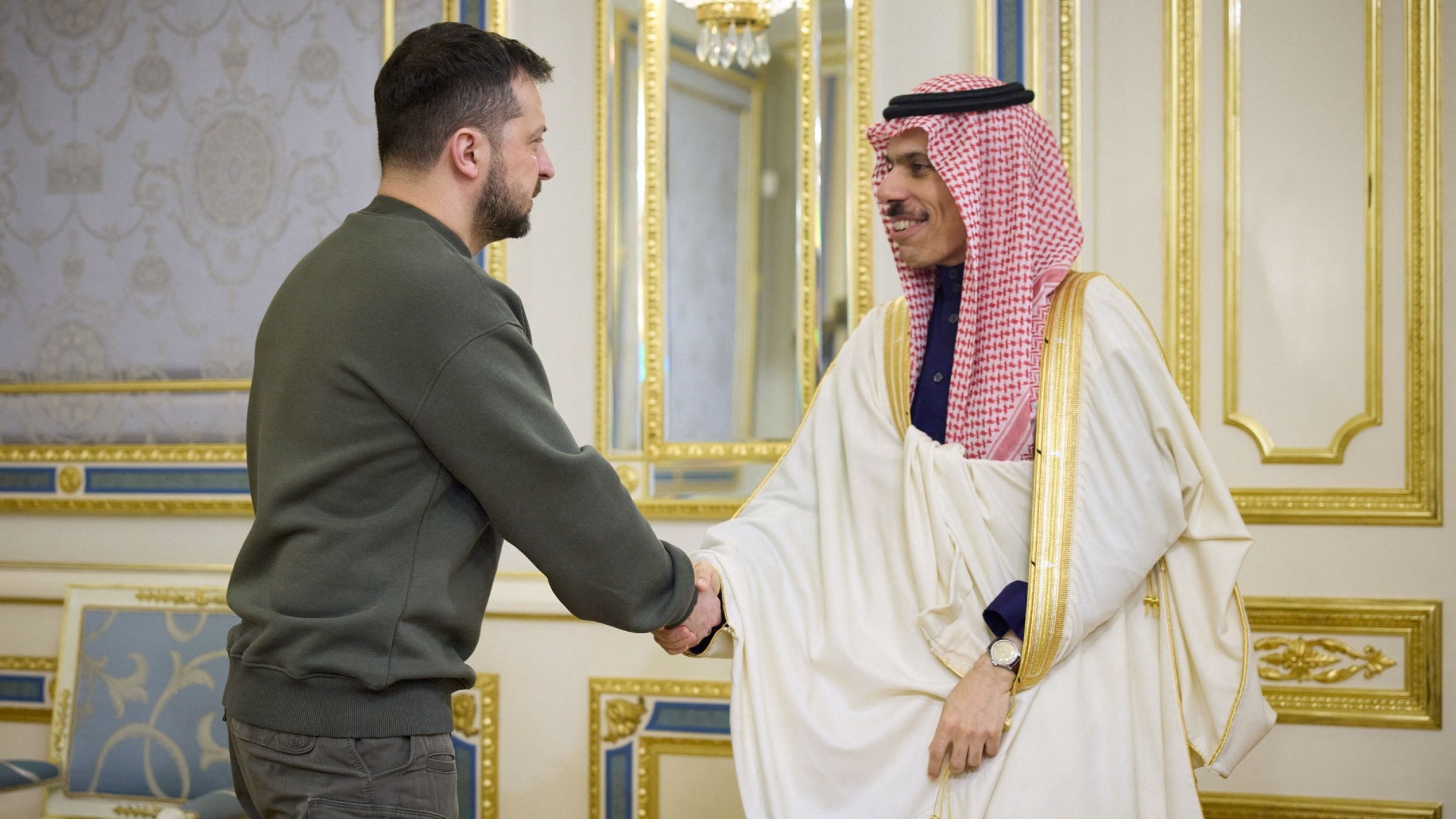 Ukraine's President Zelensky welcomes Saudi Arabia's Foreign Minister Faisal bin Farhan Al Saud in Kyiv on 26 February 2023 (AFP)