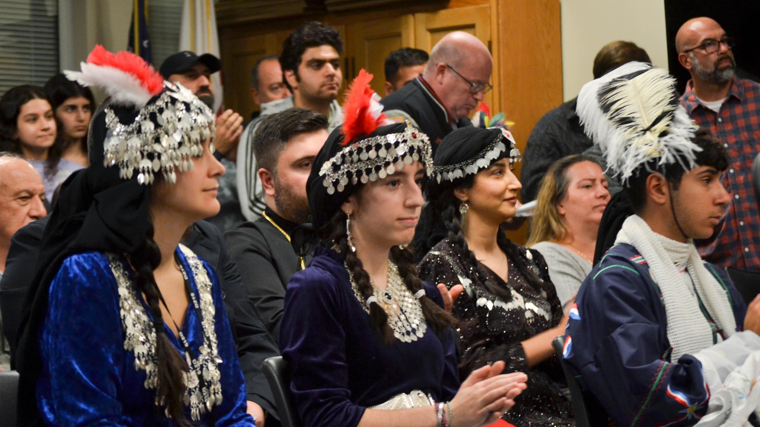 Attendees at the D219 November board meeting dress in traditional Assyrian clothing awaiting a vote on the historic Assyrian language course.