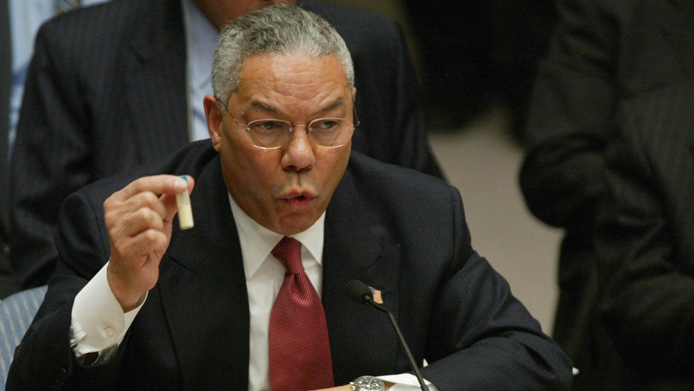 US Secretary of State Colin Powell holds up a vial that he said was the size that could be used to hold anthrax, as he accused Iraq of developing weapons of mass destruction before the United Nations Security Council, on 5 February 2003.