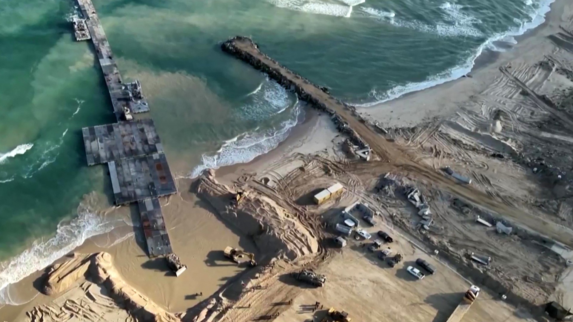 An image grab from a video released by the Israeli army on 18 May shows aid entering the Gaza Strip through a temporary pier constructed by the US (AFP/Israeli army)