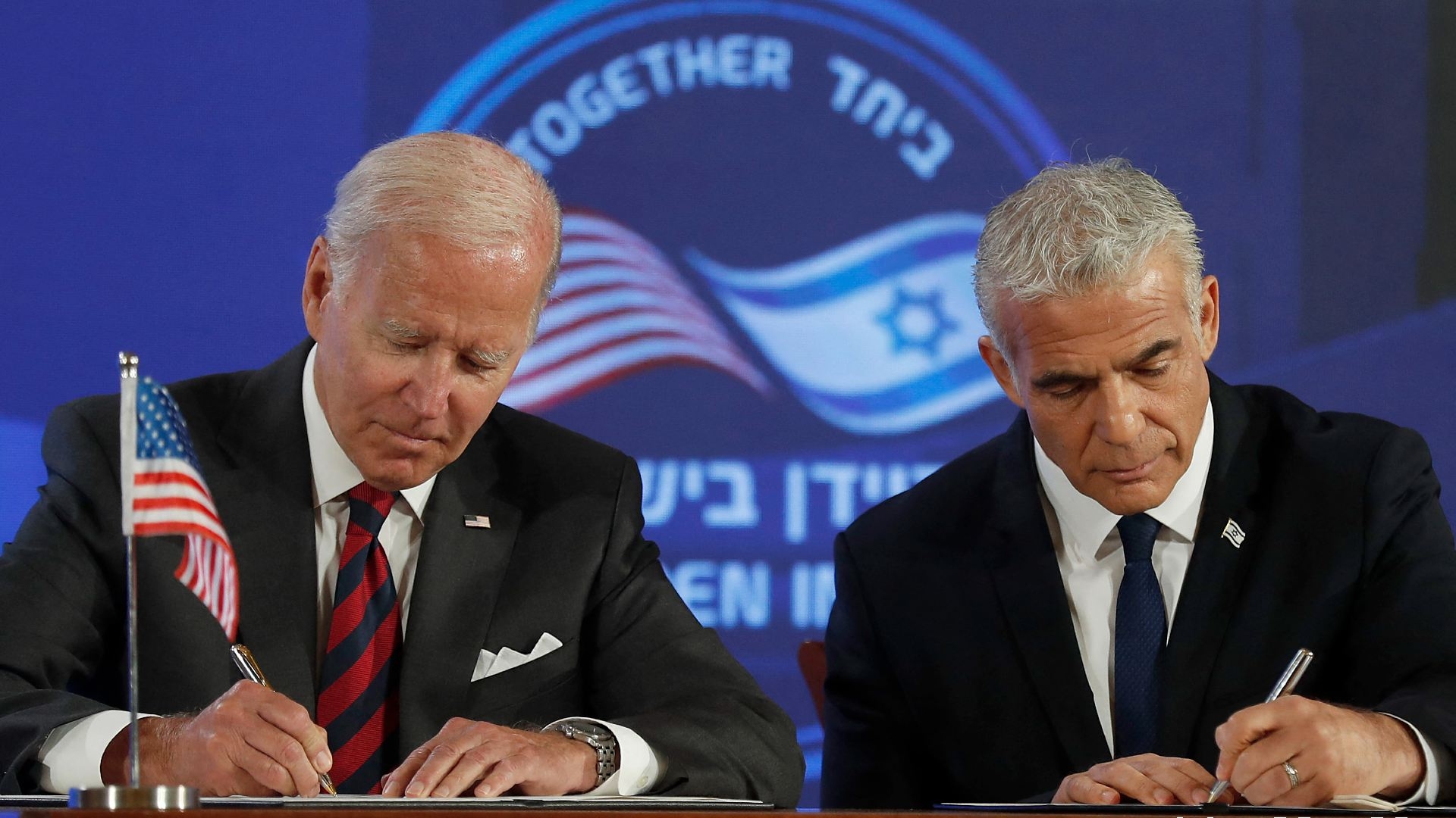 US President Joe Biden and Israel's caretaker Prime Minister Yair Lapid, sign a security pledge in Jerusalem, on 14 July 2022.