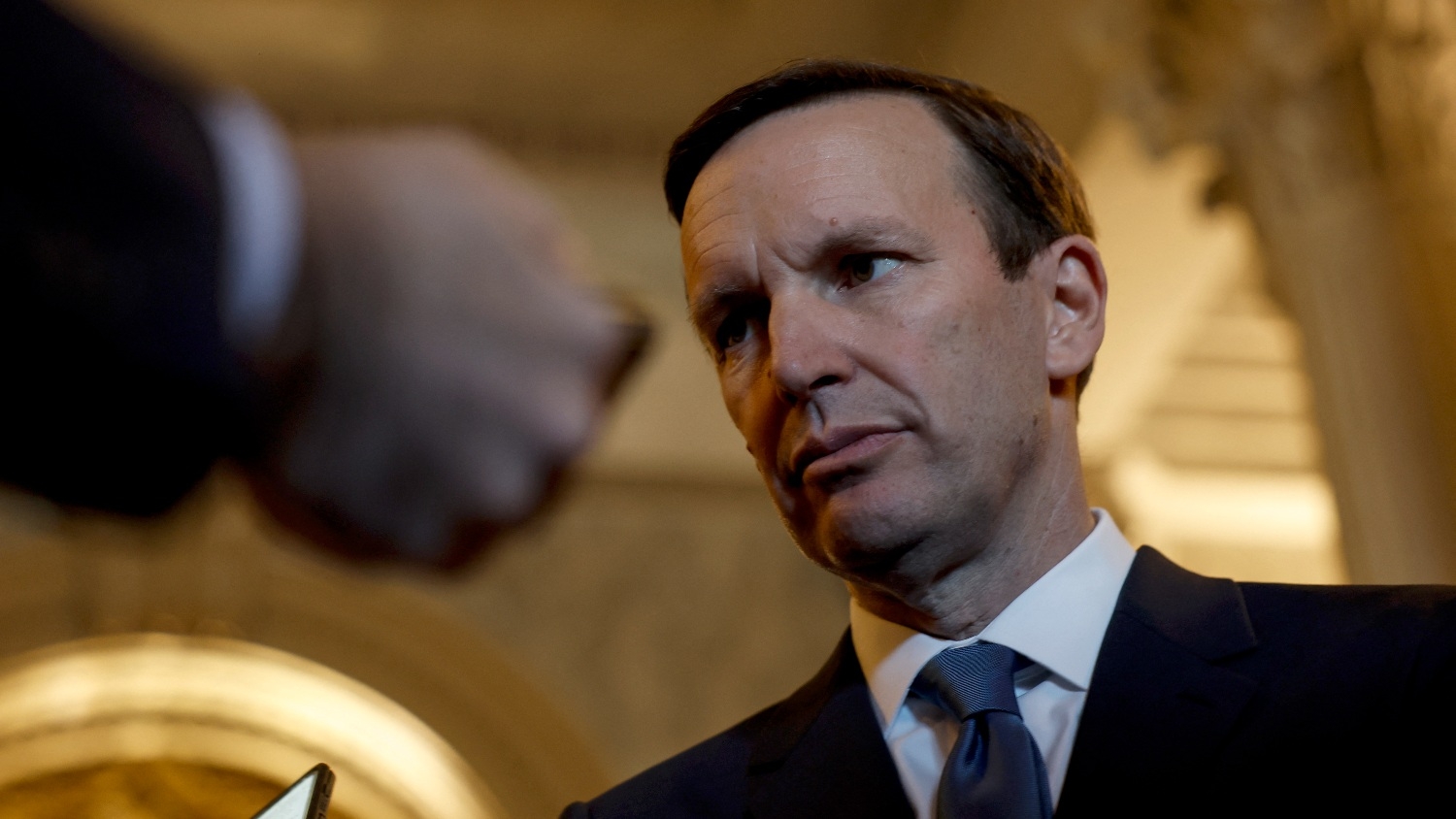 Senator Chris Murphy speaks to reporters outside of the Senate Chambers of the US Capitol on 21 June 2022 in Washington.