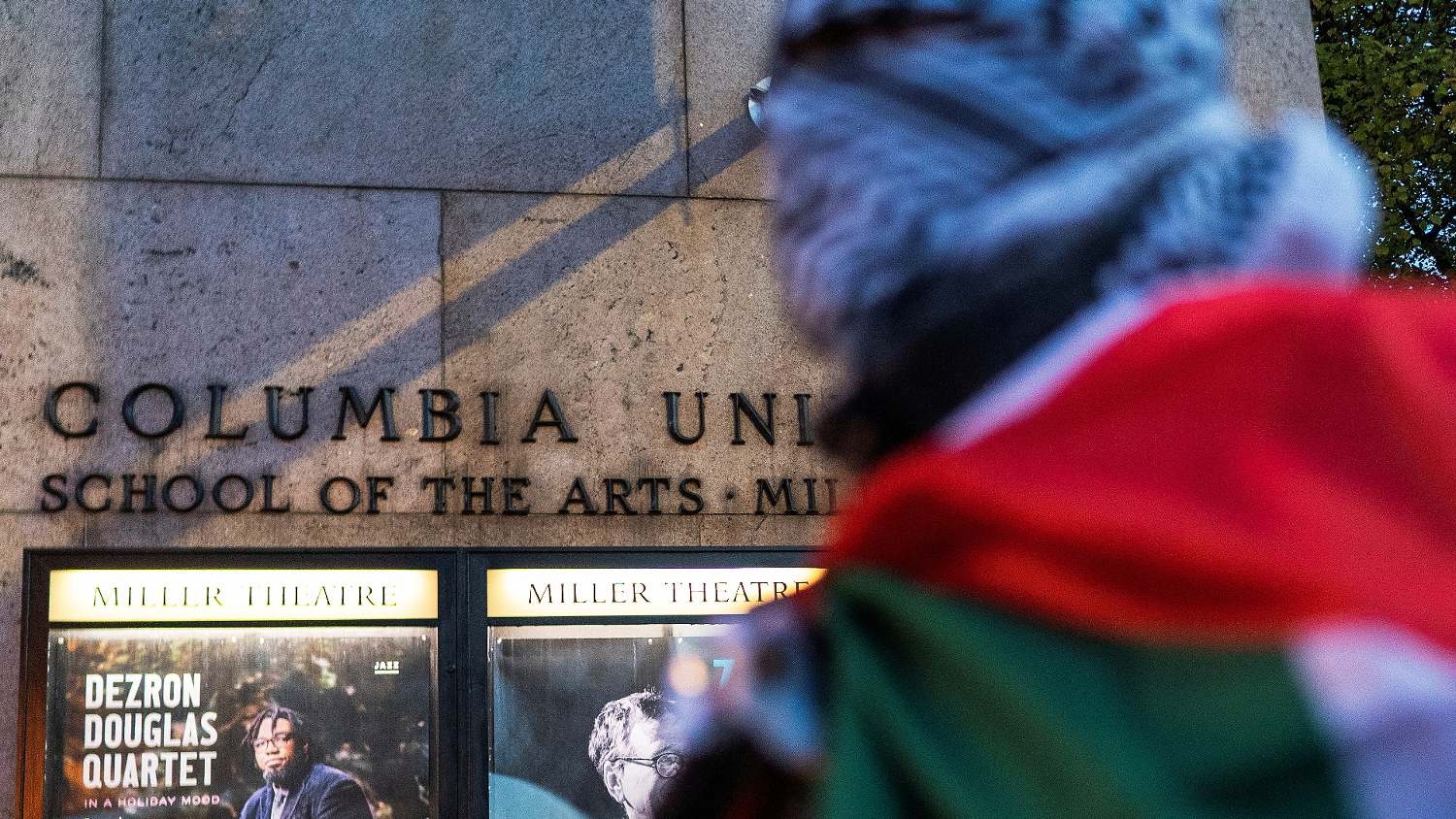 A demonstrator attends a rally in support of Palestinians amid the ongoing conflict between Israel and Hamas, outside the Columbia University in New York on 15 November 15 2023