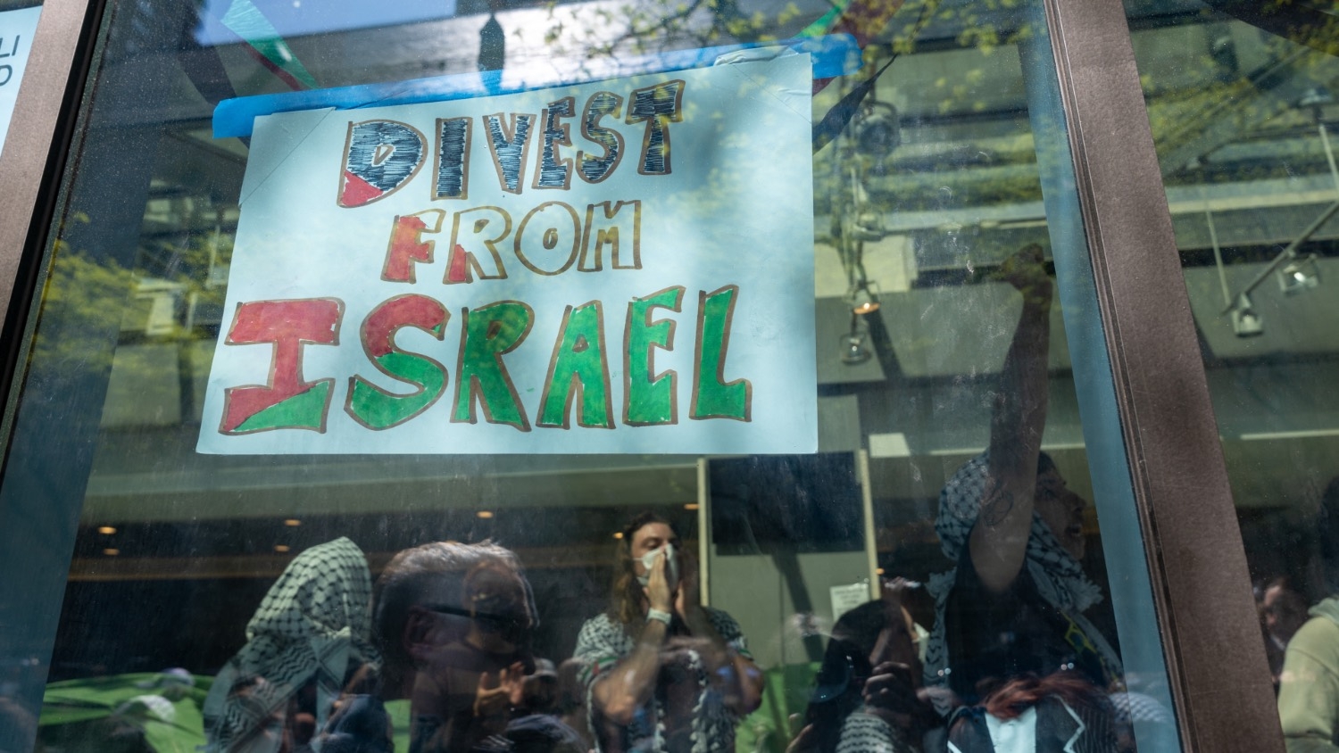 Pro-Palestinian protesters occupy a building where they had established an encampment at Fordham University Lincoln Center campus on 1 May 2024 in New York City.