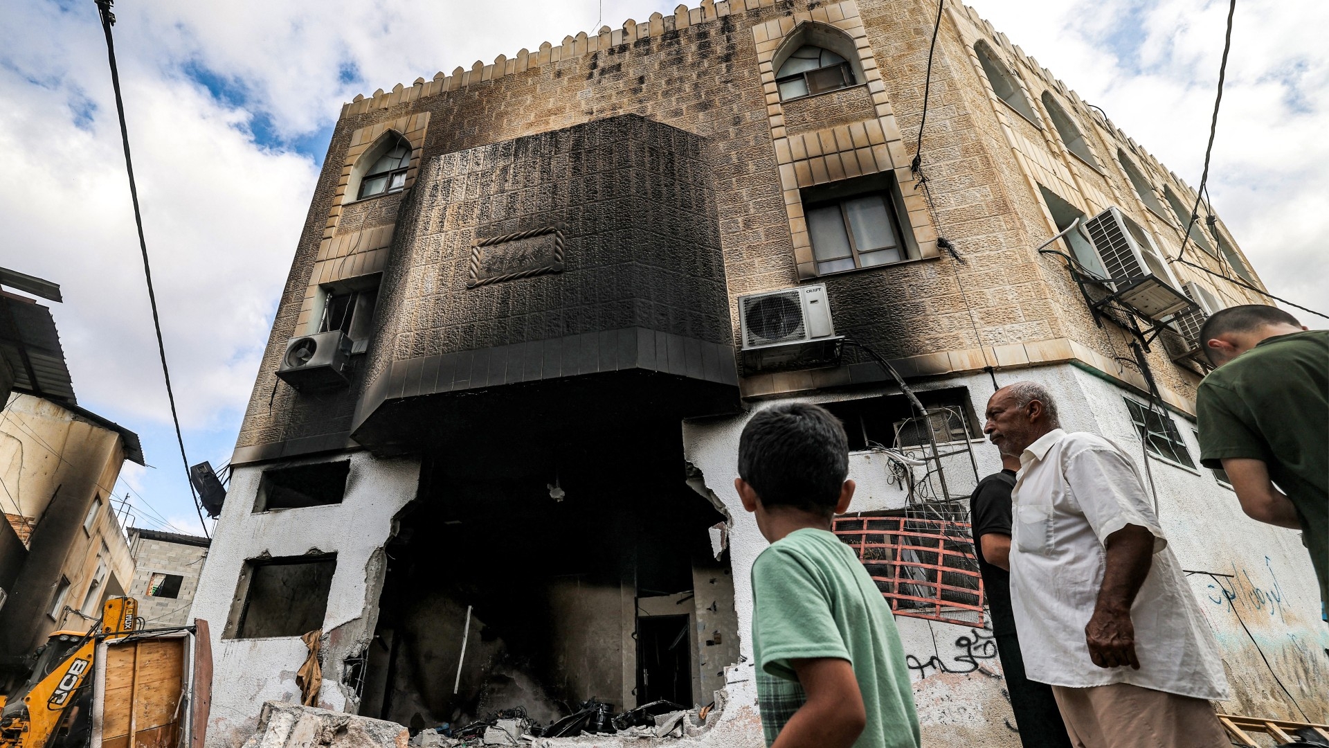 People inspect damage to a mosque building following an Israeli military operation in the Fara camp for Palestinian refugees near Tubas in the north of the occupied West Bank on 29 August 2024 (AFP/Zain Jaafar)