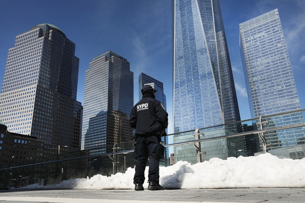 A counter terrorism officer stands in front of One World Trade Center at ground zero in Manhattan on 20 March 2017 in New York City.