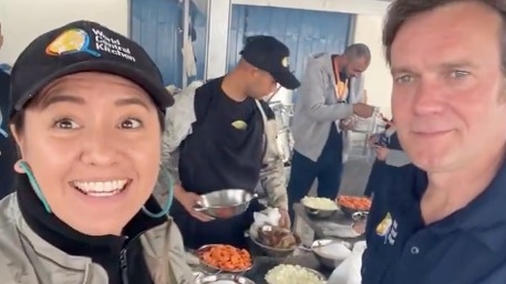 Australian citizen Lalzawmi "Zomi" Frankcom, 44, (Lef) in a social media video on 25 March in Deir el-Balah. World Central Kitchen has provided more than 37 million meals to displaced people in Gaza since 7 October. (X/WCK)