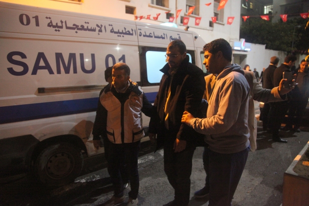 An ailing hunger striker gets taken away by an ambulance (MEE/Thessa Lageman)